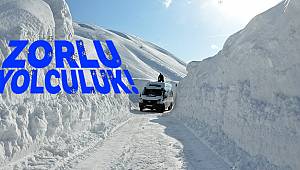 Yüksekliği 6 metreyi geçen kar yığınları arasında yolculuk