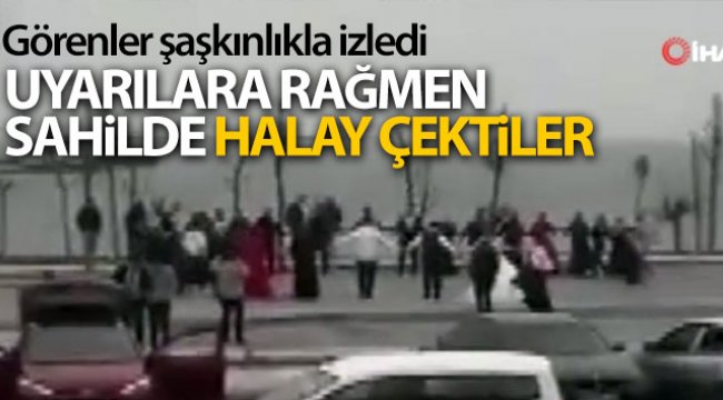 Yetkililer 'evde kal' uyarısı yaptı, gelin ve damat sahilde halay çekti