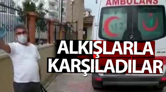 Taburcu olan Korona virüs hastası, komşularınca alkışlarla karşılandı