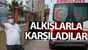 Taburcu olan Korona virüs hastası, komşularınca alkışlarla karşılandı